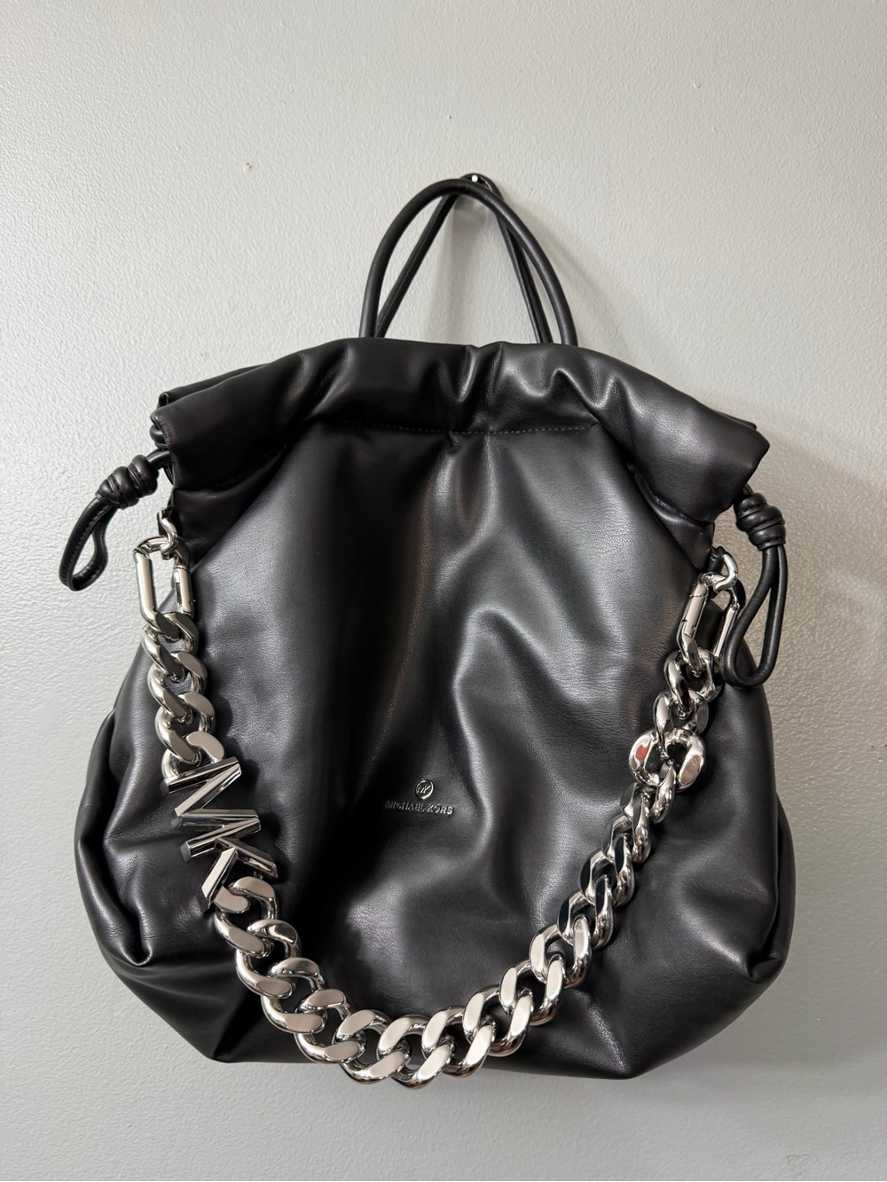 Michael Kors Lina Drawstring Bag, featuring a chunky silver chain